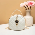 Mini white quilted circular crossbody bag with cat charm and gold chain strap - White