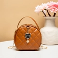 Caramel round crossbody bag with quilted embroidery and cute black cat charm accessory - Brown