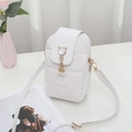 White quilted small crossbody bag with cat-shaped clasp and pearl charm detail - White