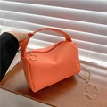 Orange lychee pattern pillow handbag with gold chain strap and top handle design - Orange
