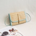 Mini light blue woven straw crossbody bag with golden tassel detail and thin shoulder strap - Blue