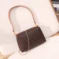 Brown leather crossbody pillow bag with gold geometric patterns and chain strap - Coffee