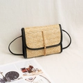 Beige woven straw crossbody bag with black leather trim and hanging gold tassel - Black