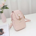 Pink quilted crossbody phone bag with pearl tassel and cute metal cat-ear clasp detail - Pink