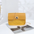 Yellow quilted shoulder bag with heart-shaped lock and gold chain strap - Yellow