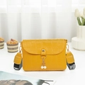 Yellow faux leather mini bag with crocodile texture, pearl charm, and printed strap - Yellow