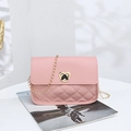Quilted light pink crossbody bag with a gold heart clasp and fine chain strap - Pink