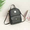Chic black mini backpack featuring geometric grid texture and elegant gold buckle detail - Black