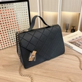Black quilted crossbody bag with gold chain strap and textured leather finish - Black
