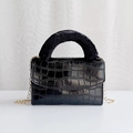 Elegant black faux crocodile skin handbag with a soft faux fur handle and gold chain strap - Black