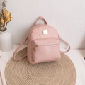 Mini mochila rosa acolchada para mujer con bolsillo frontal con cremallera y cuero sintético - Rosa