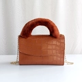 Brown crocodile pattern crossbody bag featuring soft plush handle and gold chain strap - Dark Brown