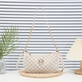 Chic beige crossbody bag with monogram pattern and gold metal M logo detail - White