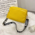Yellow embossed crossbody bag with V-shaped quilting and a stylish tassel zipper - Yellow