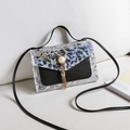 Mini holographic laser crossbody bag with pearl charms and tassel on white fabric - Black