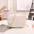 White quilted square handbag with geometric triangle pattern and gold chain strap - White