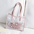 Pink transparent PVC tote bag with white cosmetic print and faux leather trim - Pink