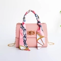 Pink lychee texture crossbody handbag with decorative floral scarf and gold chain strap - Pink