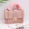 Pink faux leather crossbody bag with fluffy faux fur handle and gold chain strap - Pink
