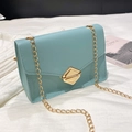 Classic light blue mini crossbody bag with gold chain strap and diamond-shaped twist lock - Blue