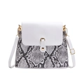 Snake skin pattern crossbody bag with white flap and gold metal clasp on white background - White