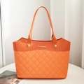 Orange PU leather bucket tote bag with quilted stitching and gold logo detail - Orange
