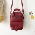 Mini zaino in pelle rosso scuro con logo TB dorato e spalline regolabili - Rosso