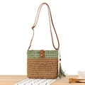 Handwoven straw crossbody bag in green and brown with leather strap and tassel detail - Green