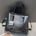 Gradient snakeskin tote bag with glossy handles and matching mini bag charm - Black