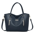 Detail shot of navy blue faux leather tote showing fine litchi texture and gold metal plate - Blue