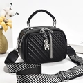 Fashionable black quilted crossbody bag with stylish wide patterned strap and bear charm - Black