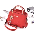 Red crossbody handbag with elegant floral embroidery and gold metal handles for women - Red
