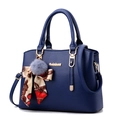 Large dark blue crossgrain leather handbag with gold logo and silk scarf on white background - Sapphire Blue