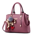 Purple lychee grain leather handbag with gold logo, fur ball, and decorative scarf - Dusty Pink