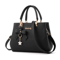 Black litchi grain leather handbag with gold bow charm and white flower pendant - Black