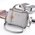 Grey faux leather handbag with rose embroidery, gold metal handles, and tassel charm - Light Gray