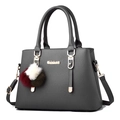 Dark grey pebble leather handbag with a three-color pompom charm and detachable strap - Dark Gray