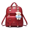 Chic red PU leather backpack for women with golden hardware and cute plush bear charm - Burgundy
