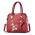 Elegante borsa a mano rosso scuro con ricamo floreale e dettagli in metallo dorato - Rosso