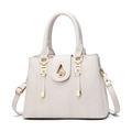 White faux leather handbag with gold hardware and stylish vertical stitching patterns - White