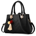 Elegant black leather handbag with V-shaped embossing and colorful tassel charm - Black