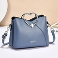 Elegante bolso de mano azul neblina con asa de corazón y correa ajustable para hombro - Azul