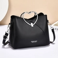 Bolso de mano negro minimalista con asa de corazón, herrajes plateados y correa - Negro