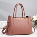 Elegant dusty pink tote bag with pebble leather texture and golden metal accents - Pink