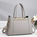 Detail of grey lychee leather tote bag with gold metal hardware and detachable strap - Gray