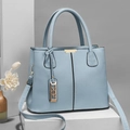 Light blue pebbled leather tote bag with gold YSL pendant and detachable strap - Light Blue