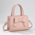 Pink bow handbag in lychee texture with top handles and adjustable shoulder strap - Pink