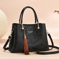 Classic black handbag with vintage floral embossing and golden hardware detail - Black