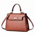 Brown crocodile-textured leather handbag with a gold twist lock and a top handle - 26CM*9CM*19CM / Earthy Yellow