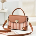 Chic brown patchwork crossbody bag with top handle and golden metal clasp closure - Earthy Yellow